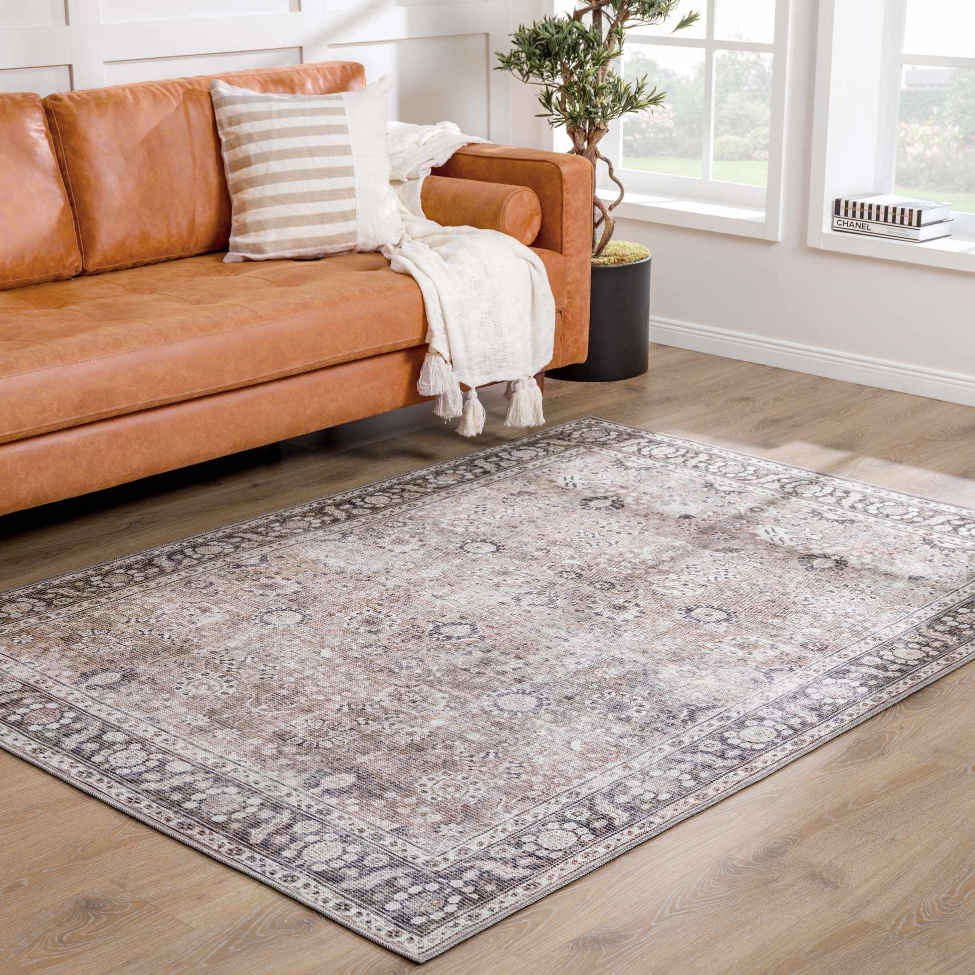 Small Ganyangan washable rug laid out by sofa living room decor