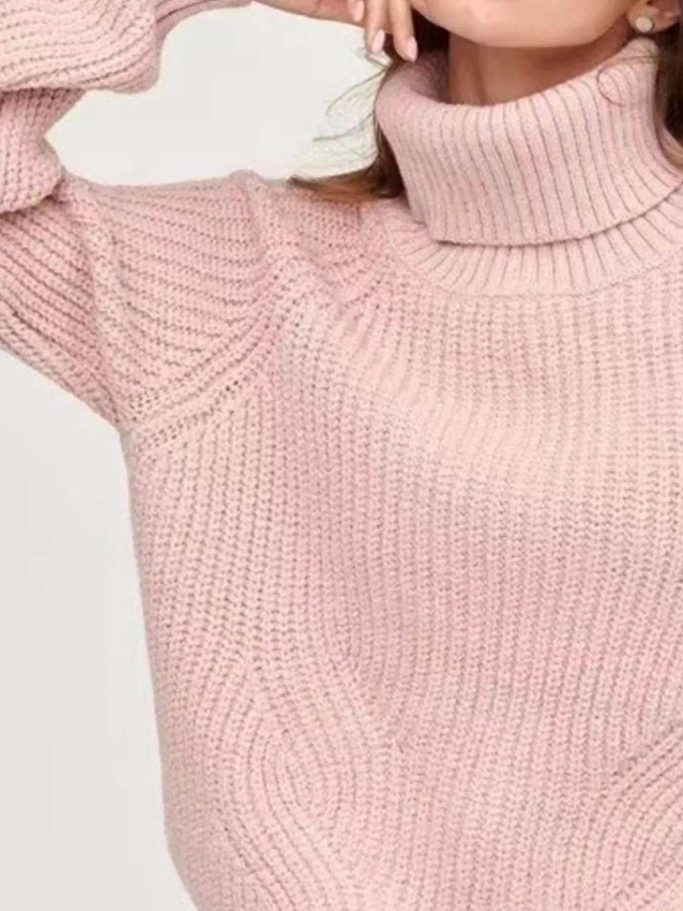 Pink oversized turtleneck long sleeve sweater collar close-up on model