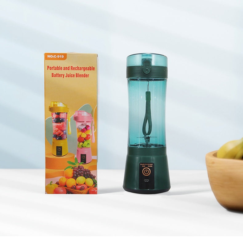 Green portable juicer blender with product packaging box
