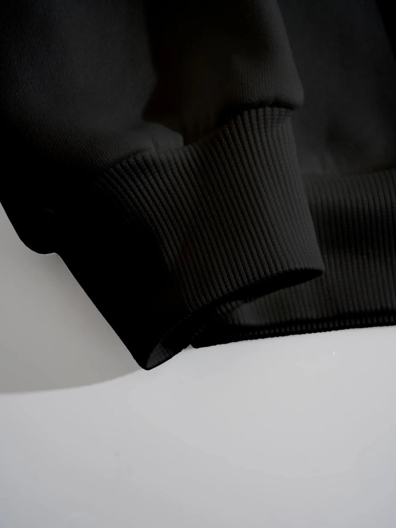 Close-up of graphic sweatshirt outside material detail
