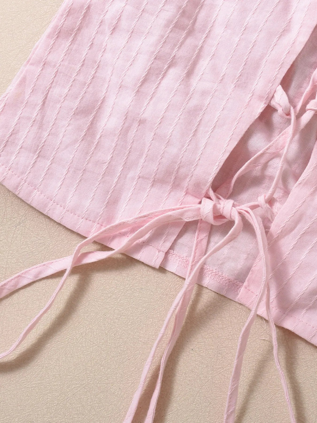 Halter neck cami top blush pink close-up back view material thread detail
