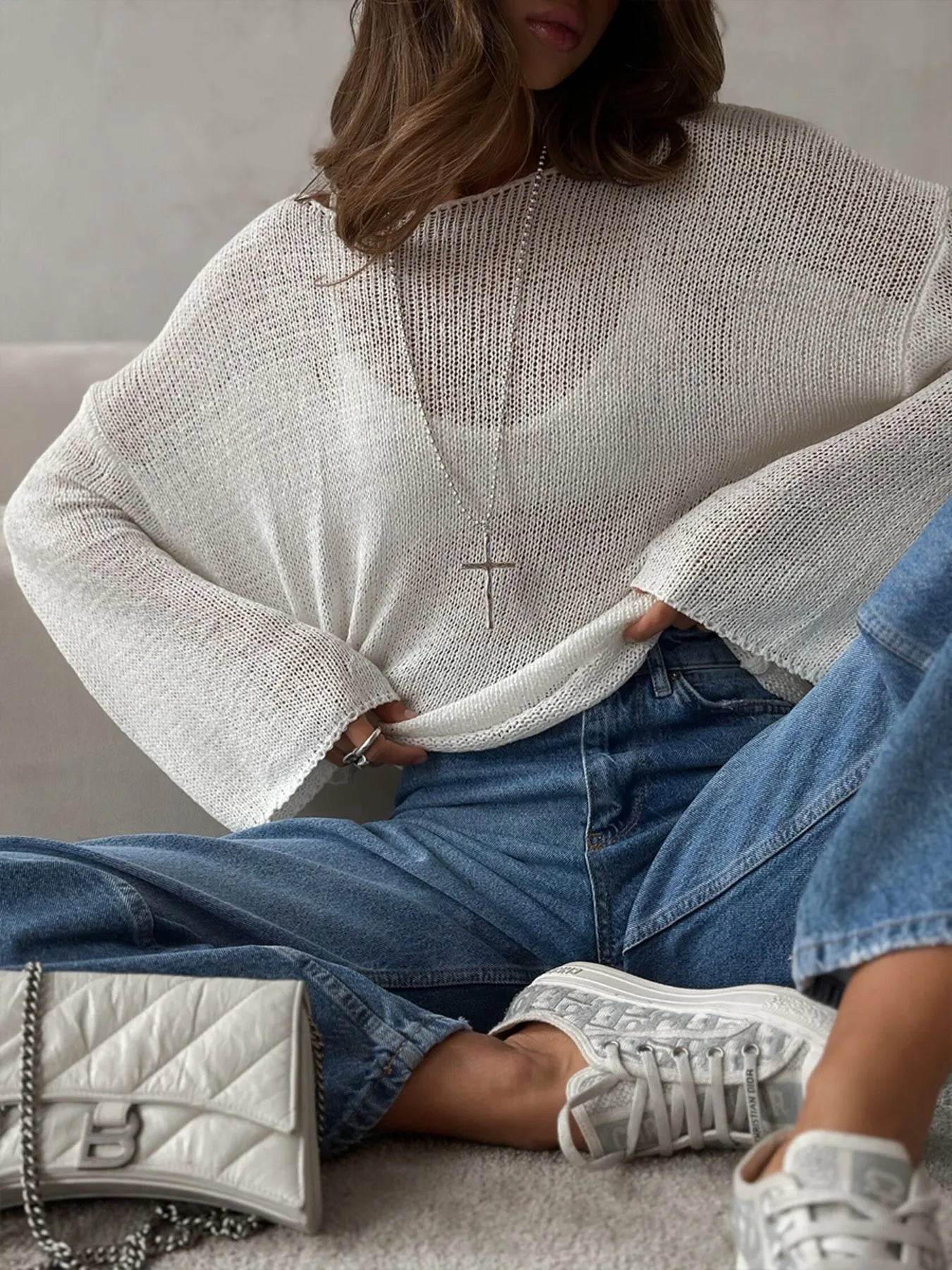 Close-up white boat neck cover up seated styling
