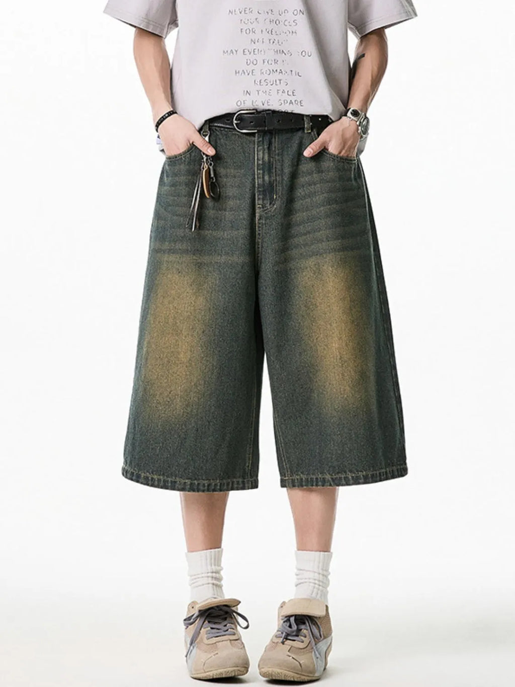 Model wearing men's plus size washed denim pocketed shorts front view
