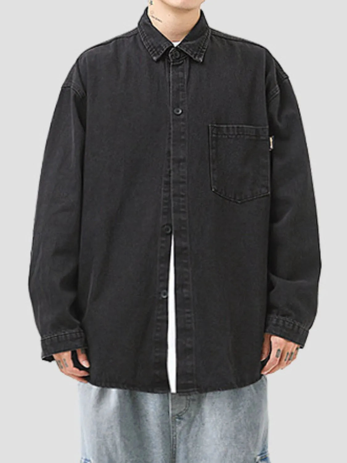 Model wearing men's plus size black denim long sleeve collared shirt front view
