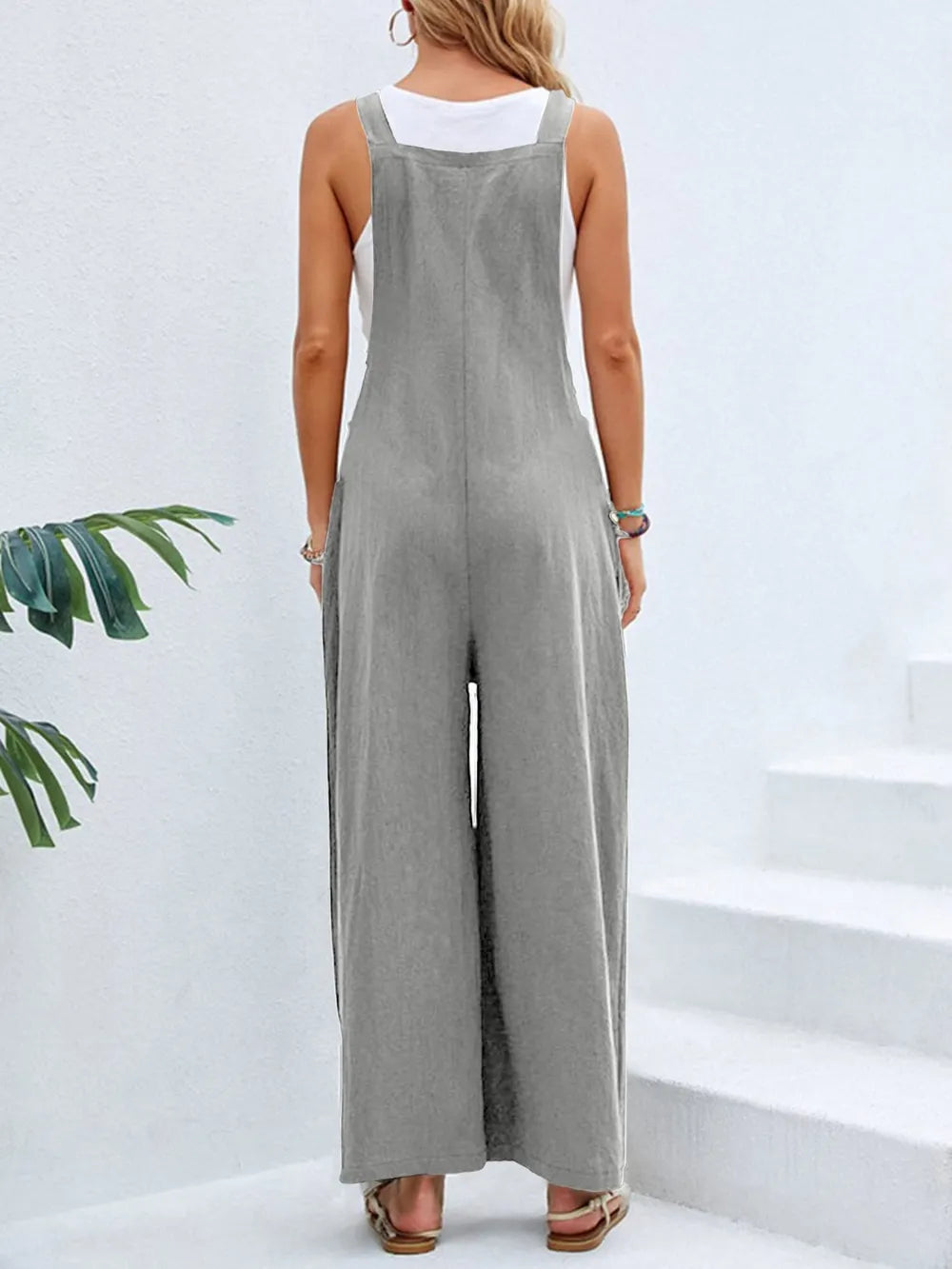 Grey square neck wide strap overalls back view on model
