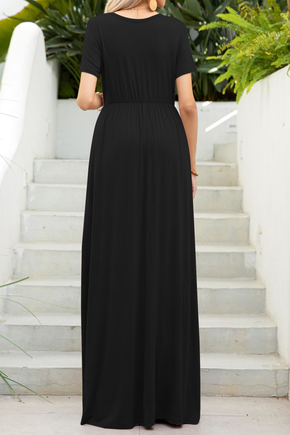 Round neck dress with pockets back view model wearing black colourway
