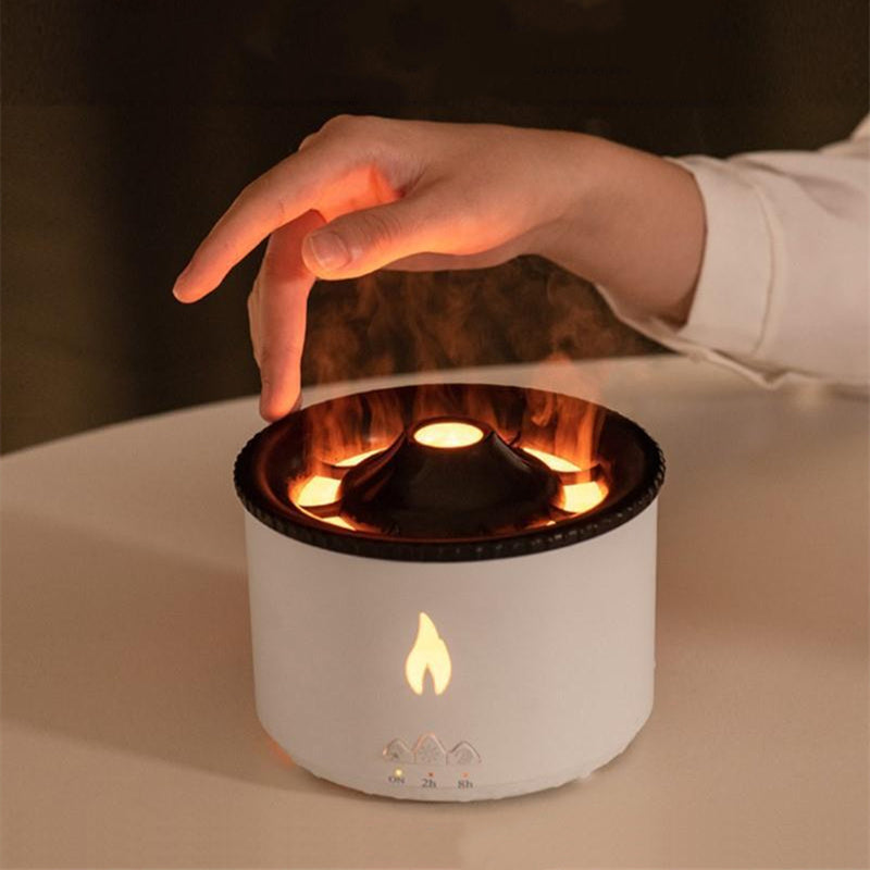 Hand demonstrating ultrasonic essential oil humidifier close-up operation
