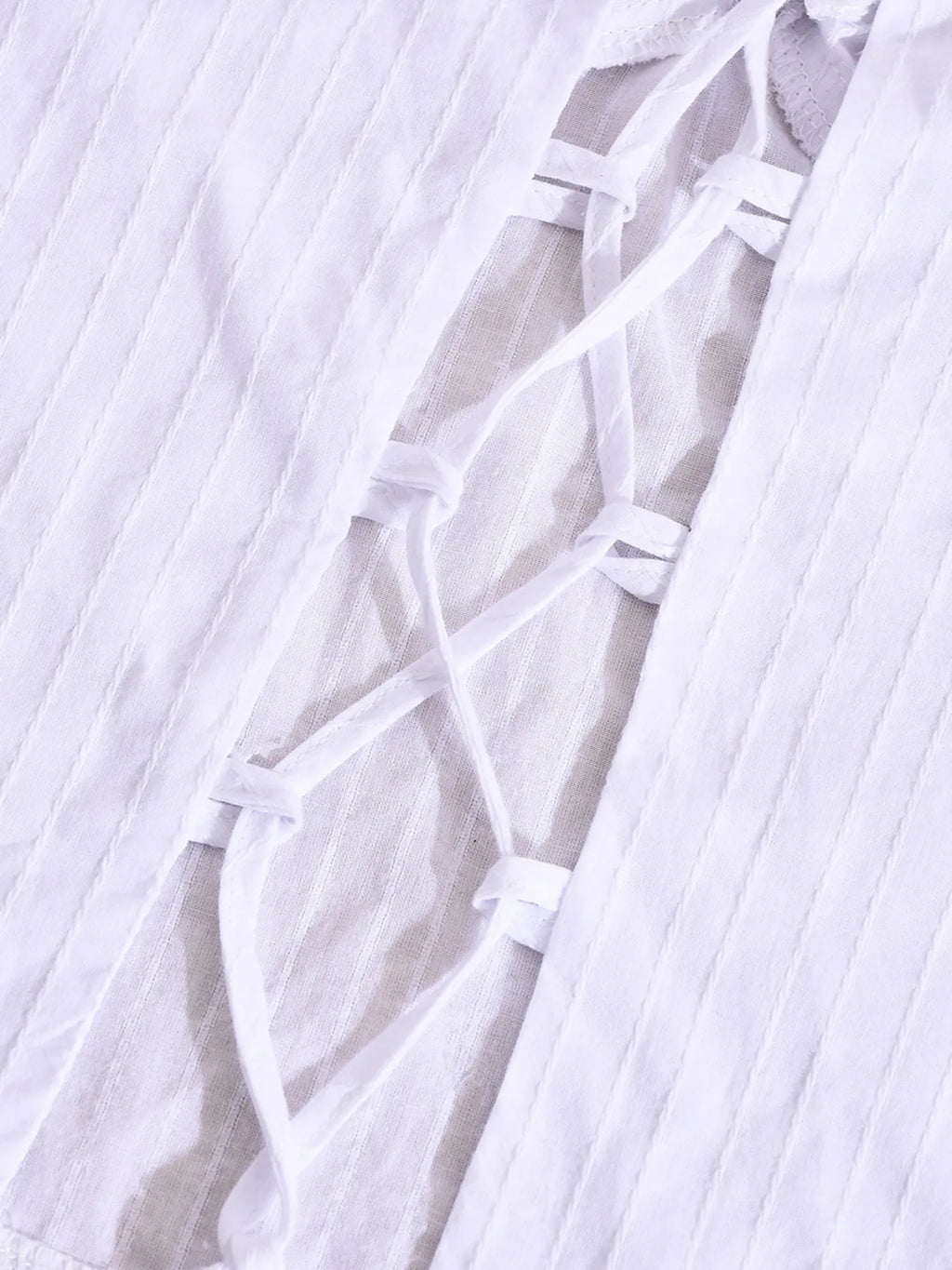 Halter neck cami top white close-up back view material thread detail
