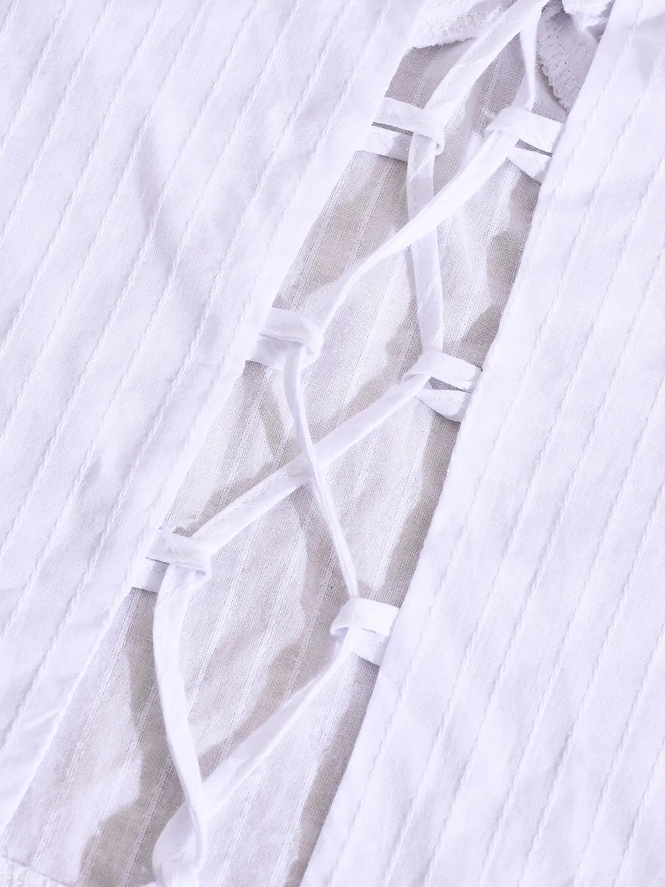 Halter neck cami top white close-up back view material thread detail
