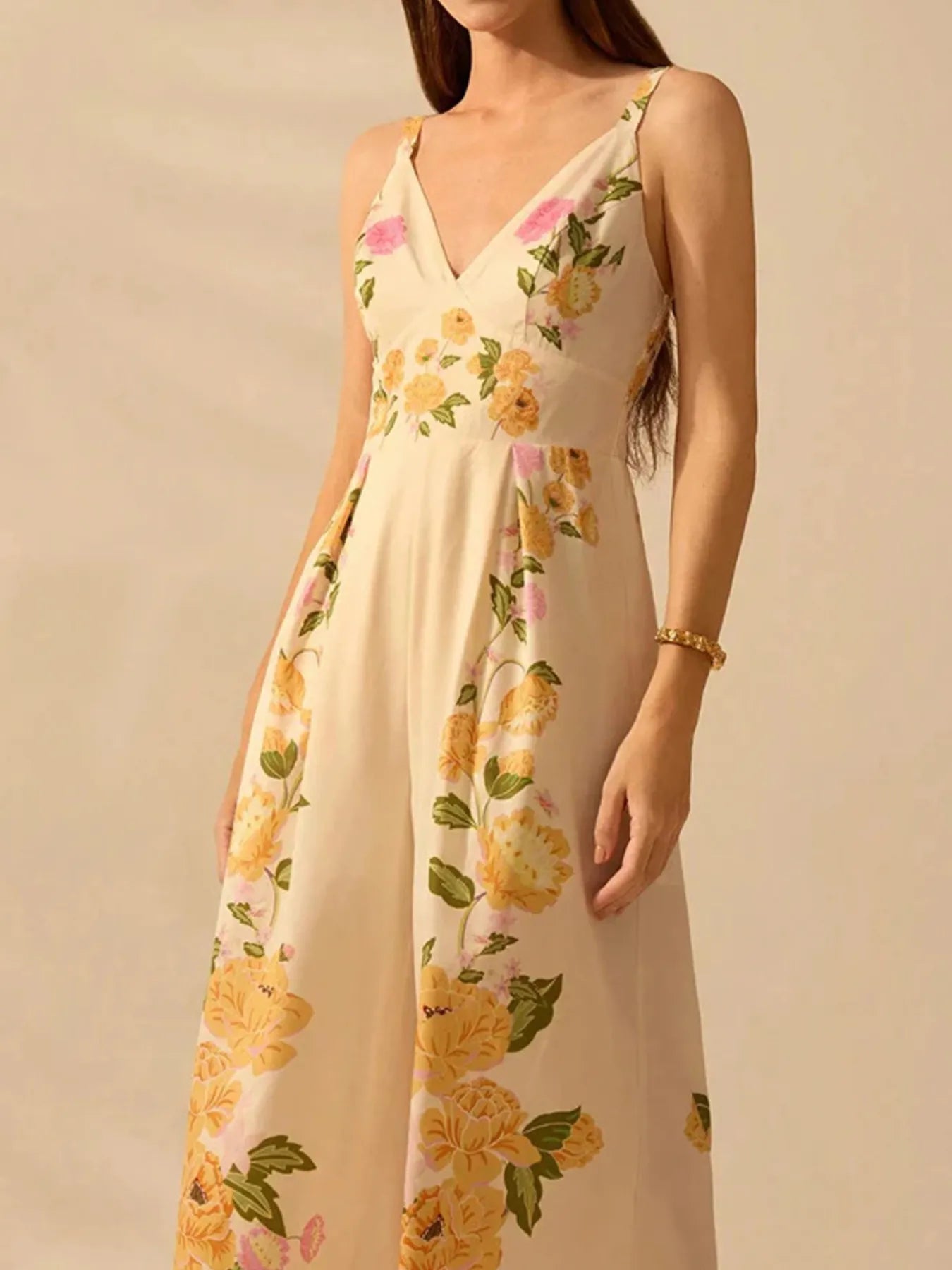 Model wearing floral print wide-leg V-neck cami jumpsuit front and side view
