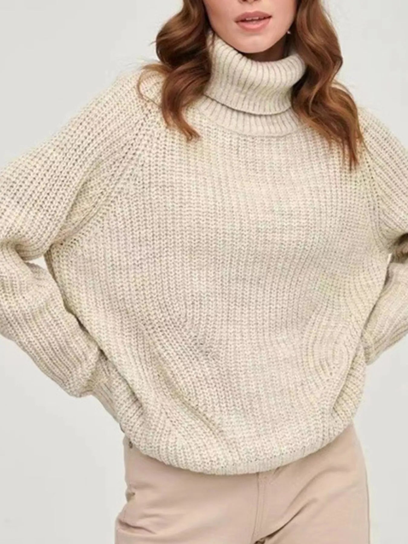 Beige oversized turtleneck long sleeve sweater front view on model