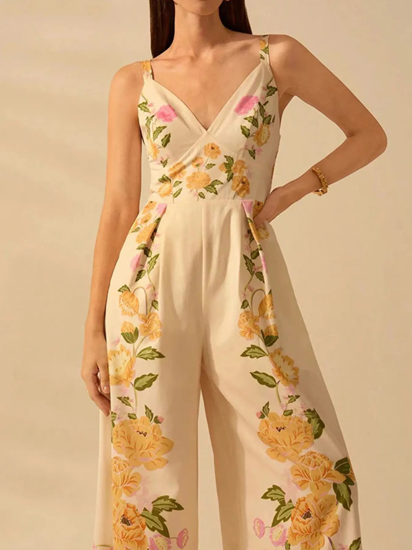 Close up detail of model in floral print wide-leg v-neck cami jumpsuit front view
