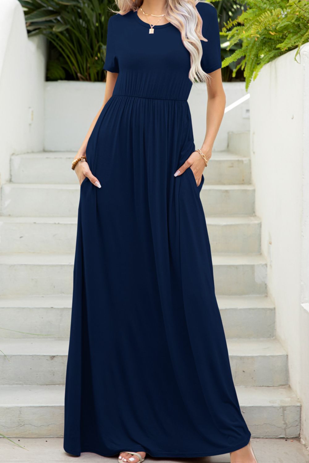 Round neck dress with pockets front view model wearing navy colourway
