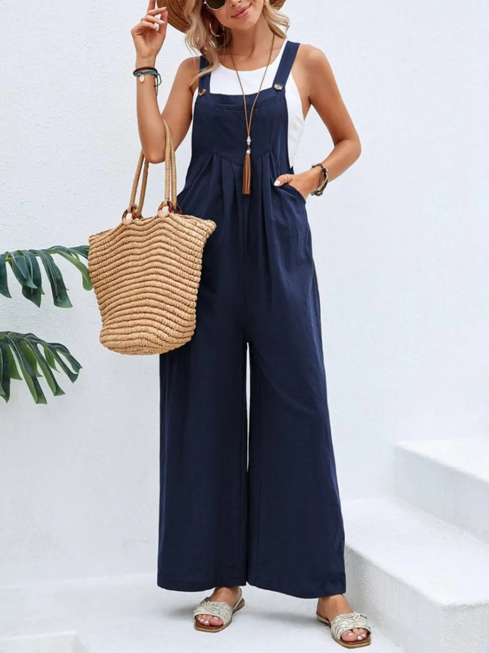 Navy square neck wide strap overalls front view on model
