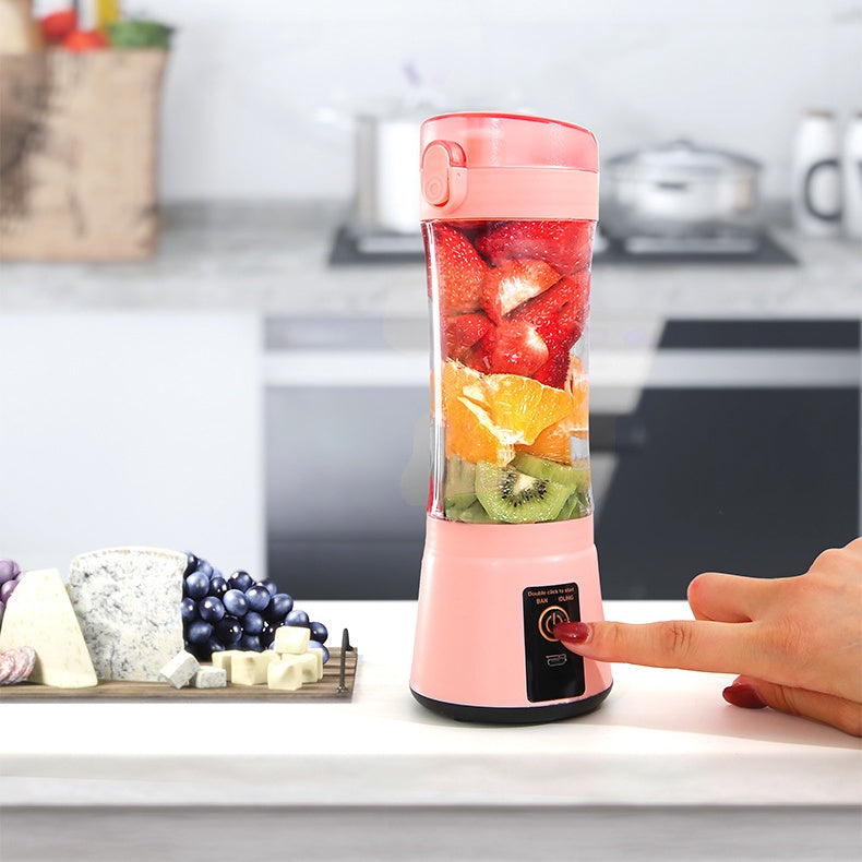 Side view portable juicer blender in action blending fresh fruit
