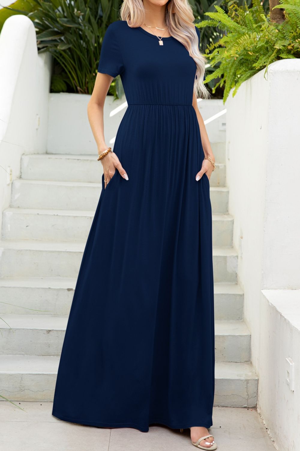 Round neck dress with pockets side view model wearing navy colourway
