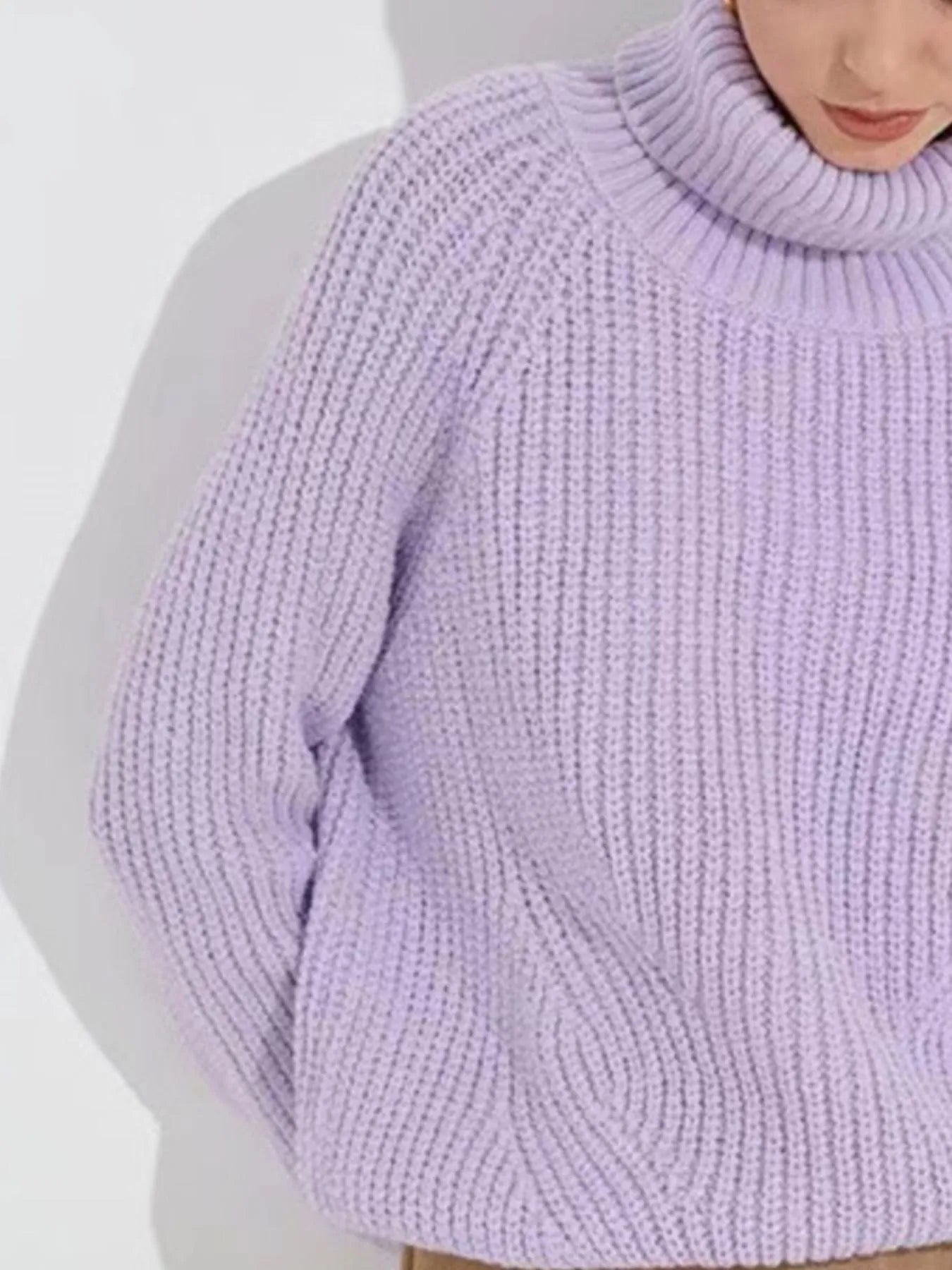 Light purple oversized turtleneck long sleeve sweater and sleeve close-up on model