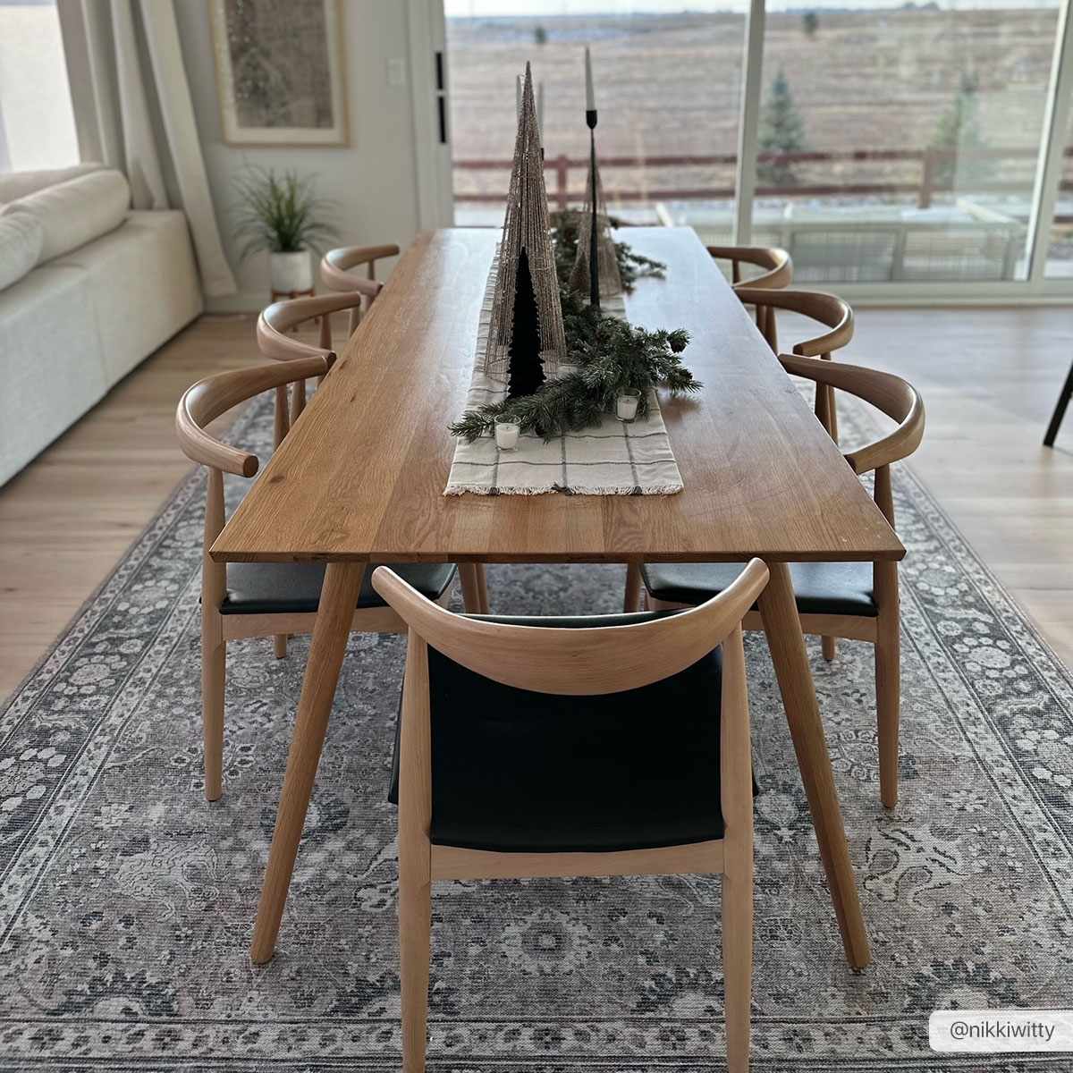 Large Ganyangan washable rug displayed under long dining table home decor
