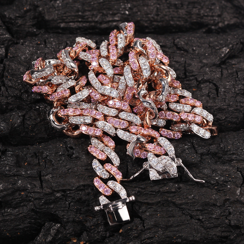 Rose gold Cuban chain necklace on dark textured surface jewelry
