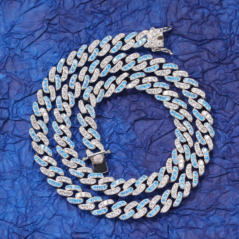 Silver  Cuban chain necklace with blue stones on dark blue background
