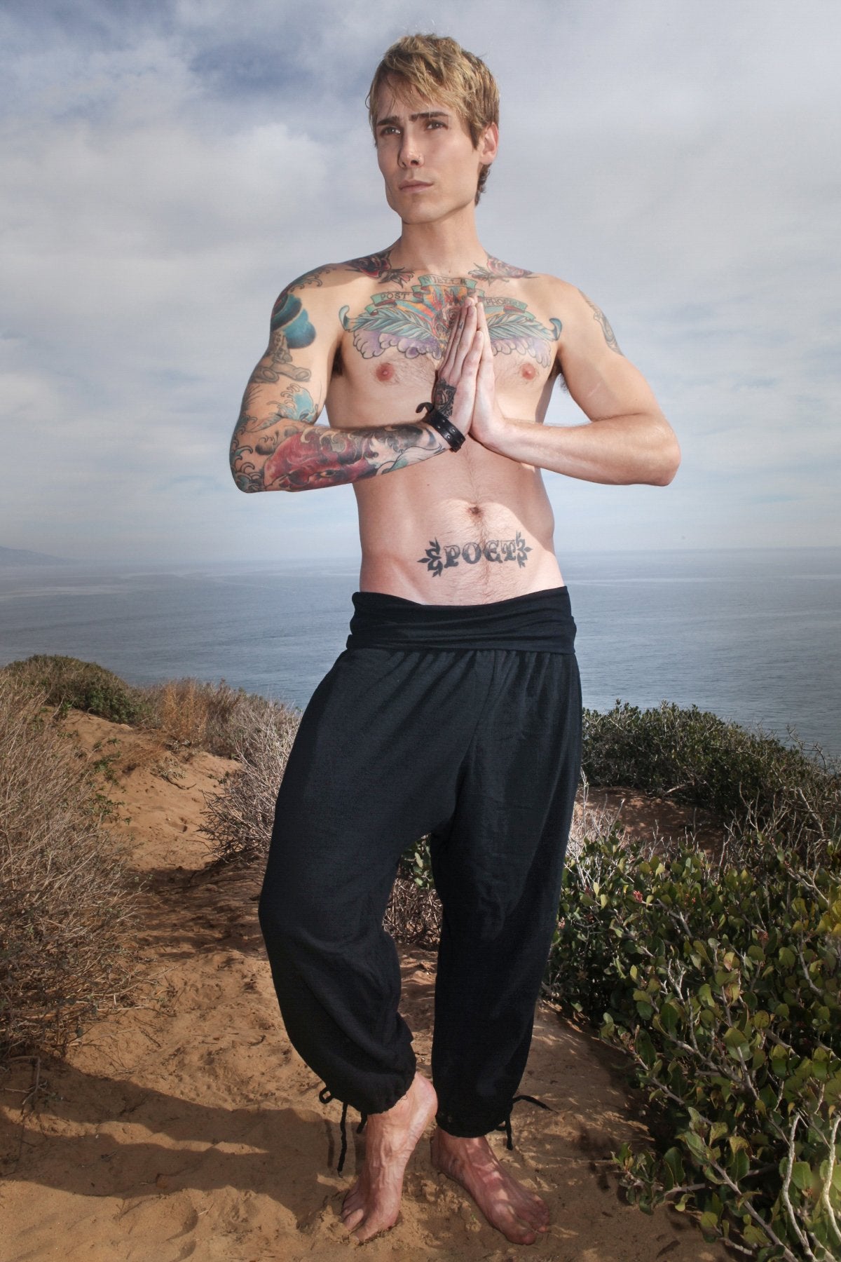 Model wearing black men's yoga kung fu pants long front view
