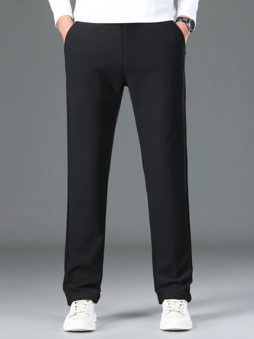 Men's loose fit pants with pockets - detailed front view in black 
