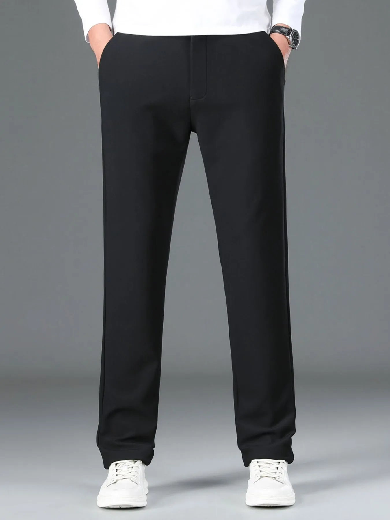 Men's loose fit pants with pockets - detailed front view in black 
