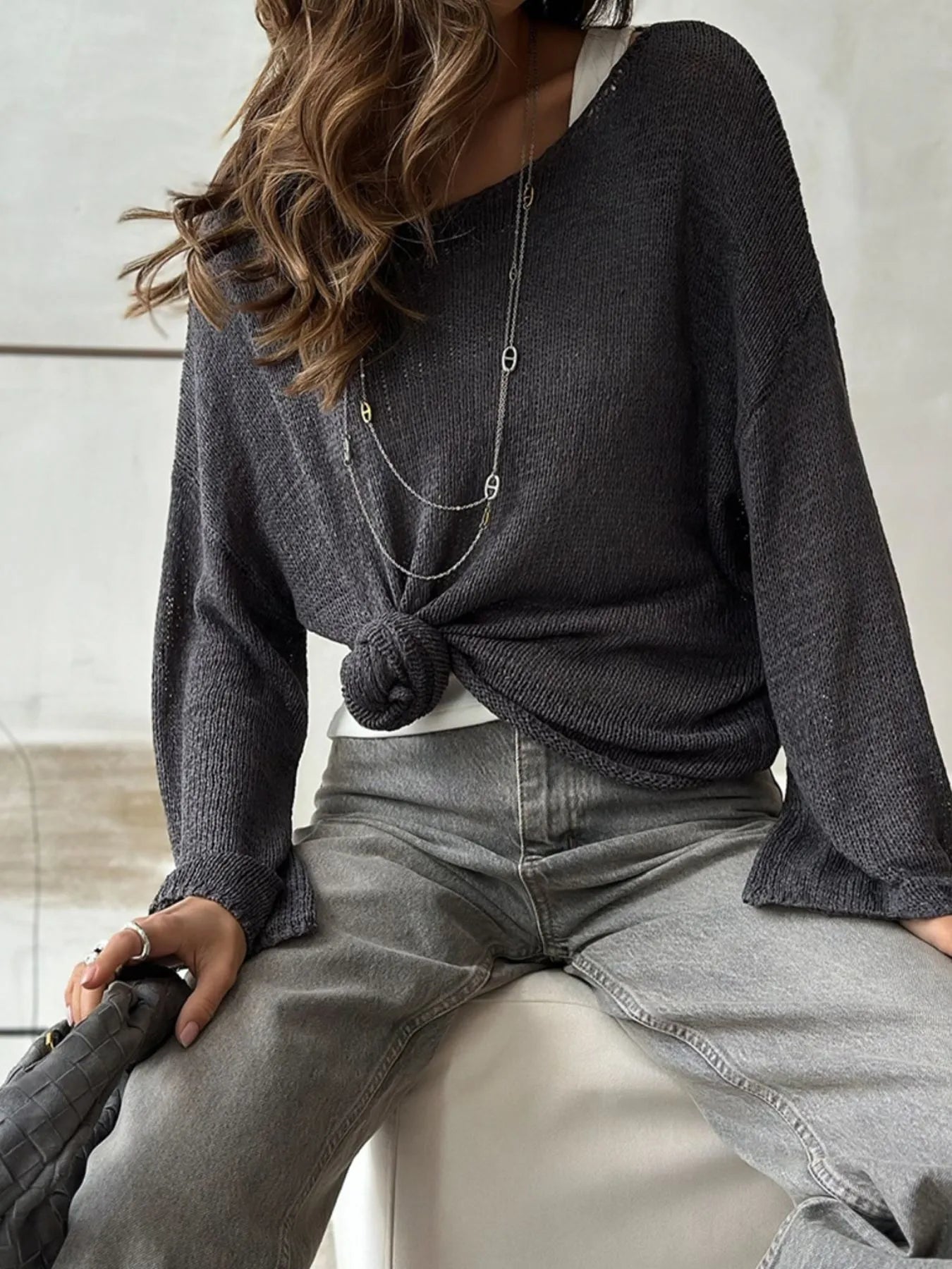 Black knit cover up styled with knot seated view
