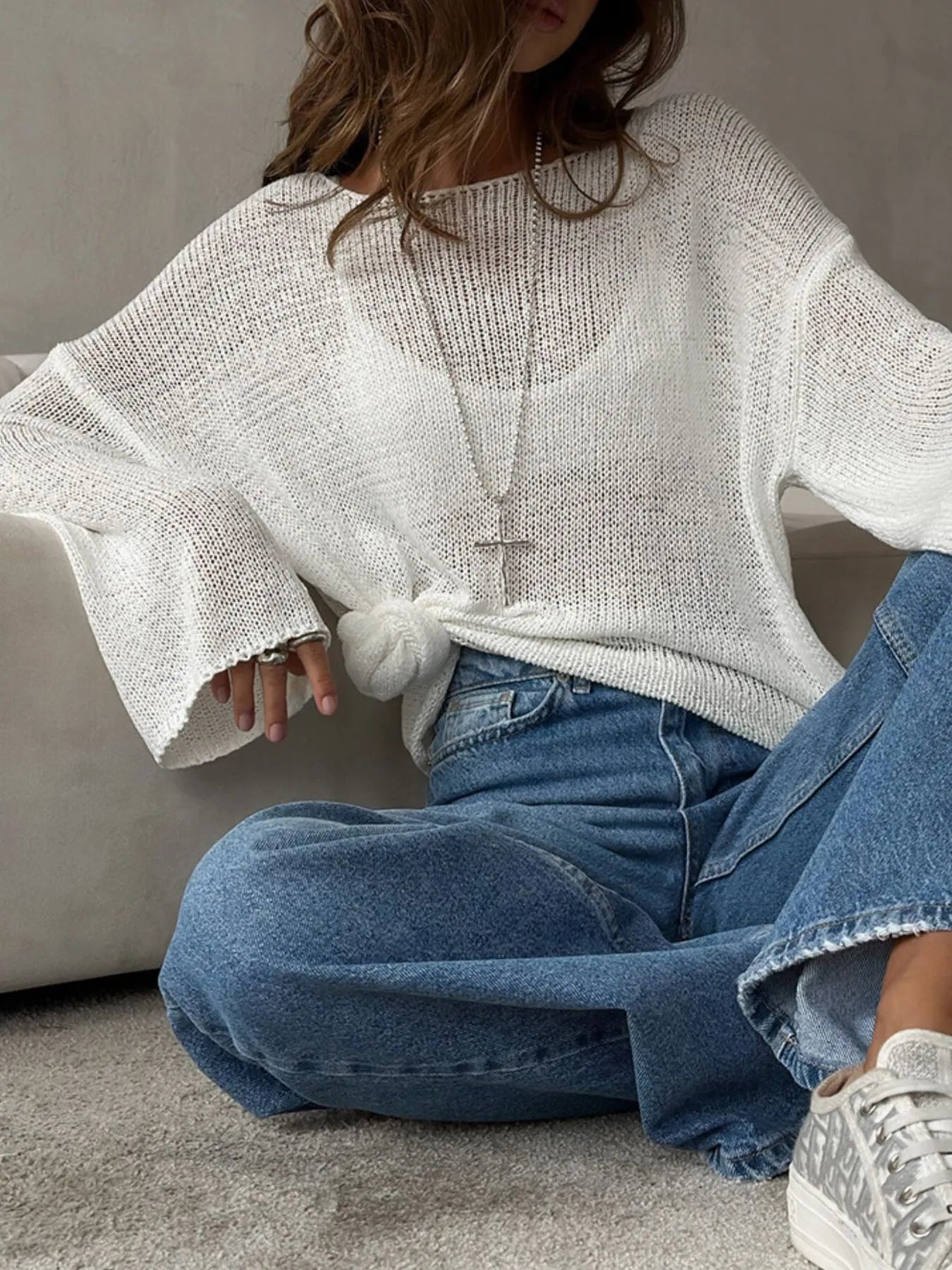 White knit cover up styled with knot seated model view
