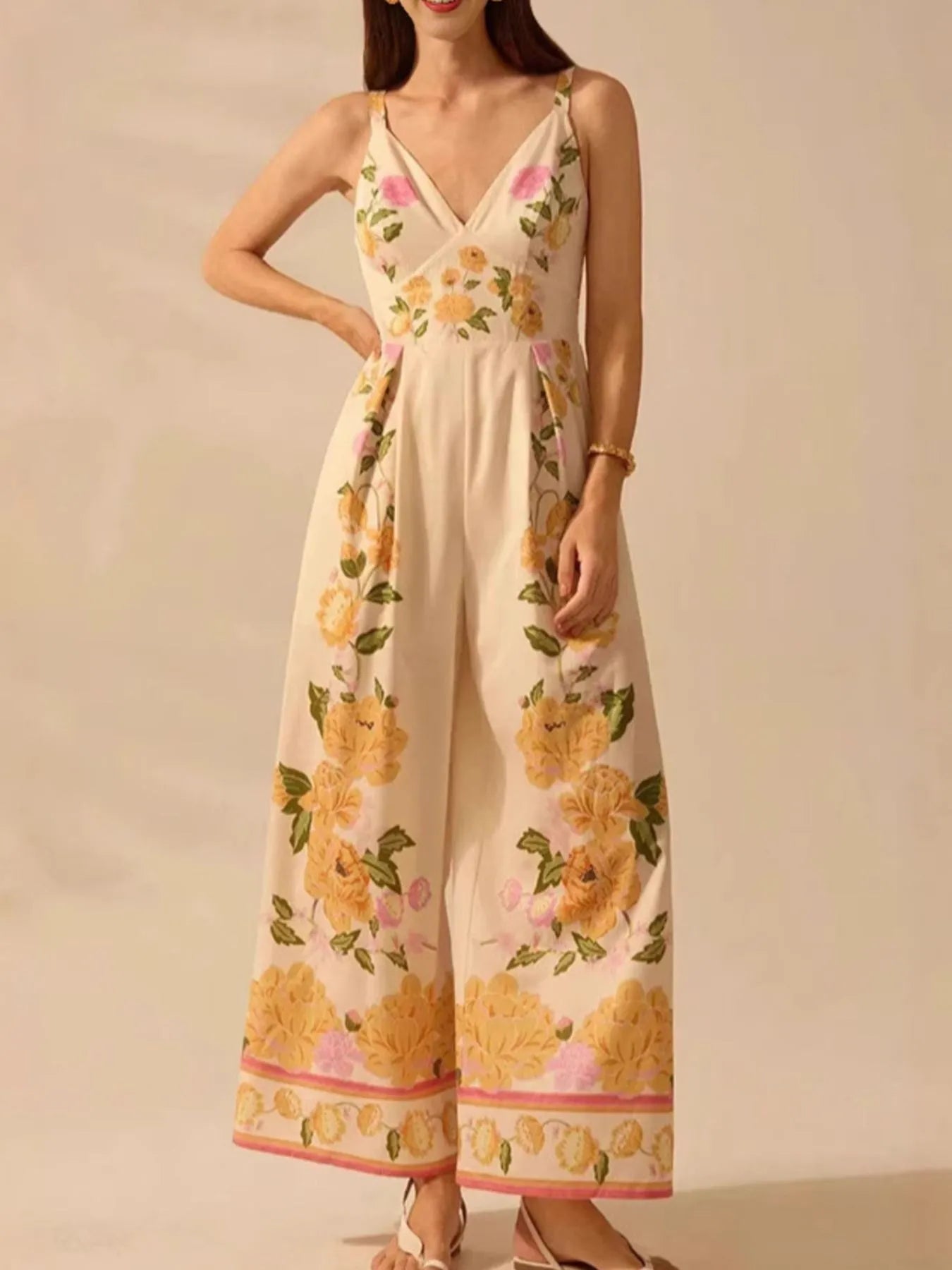Model wearing floral print wide-leg V-neck cami jumpsuit front view
