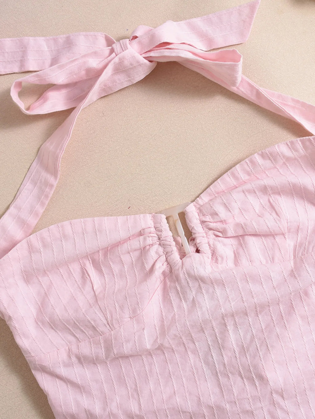 Halter neck cami top blush pink close-up front view product display
