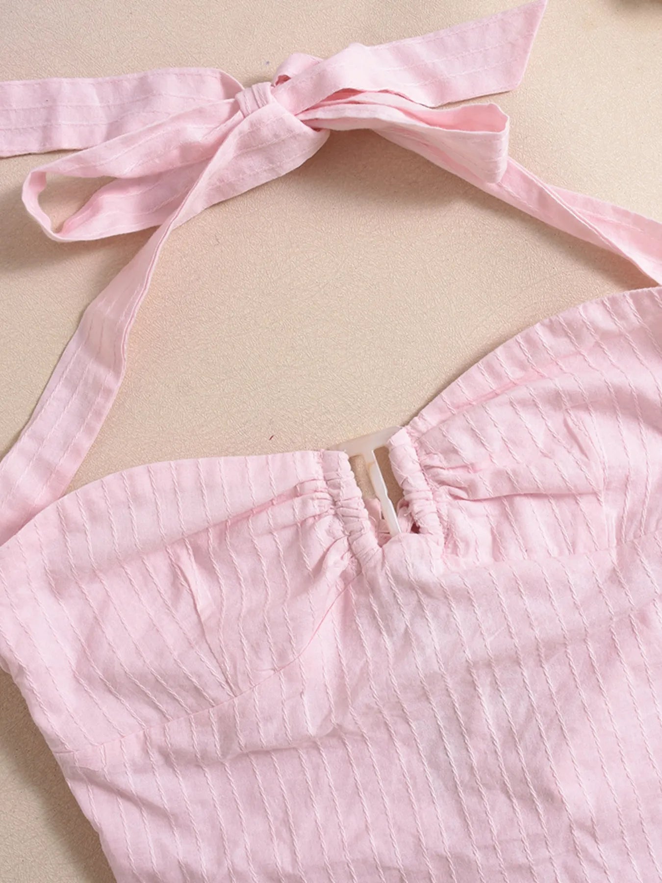 Halter neck cami top blush pink close-up front view product display
