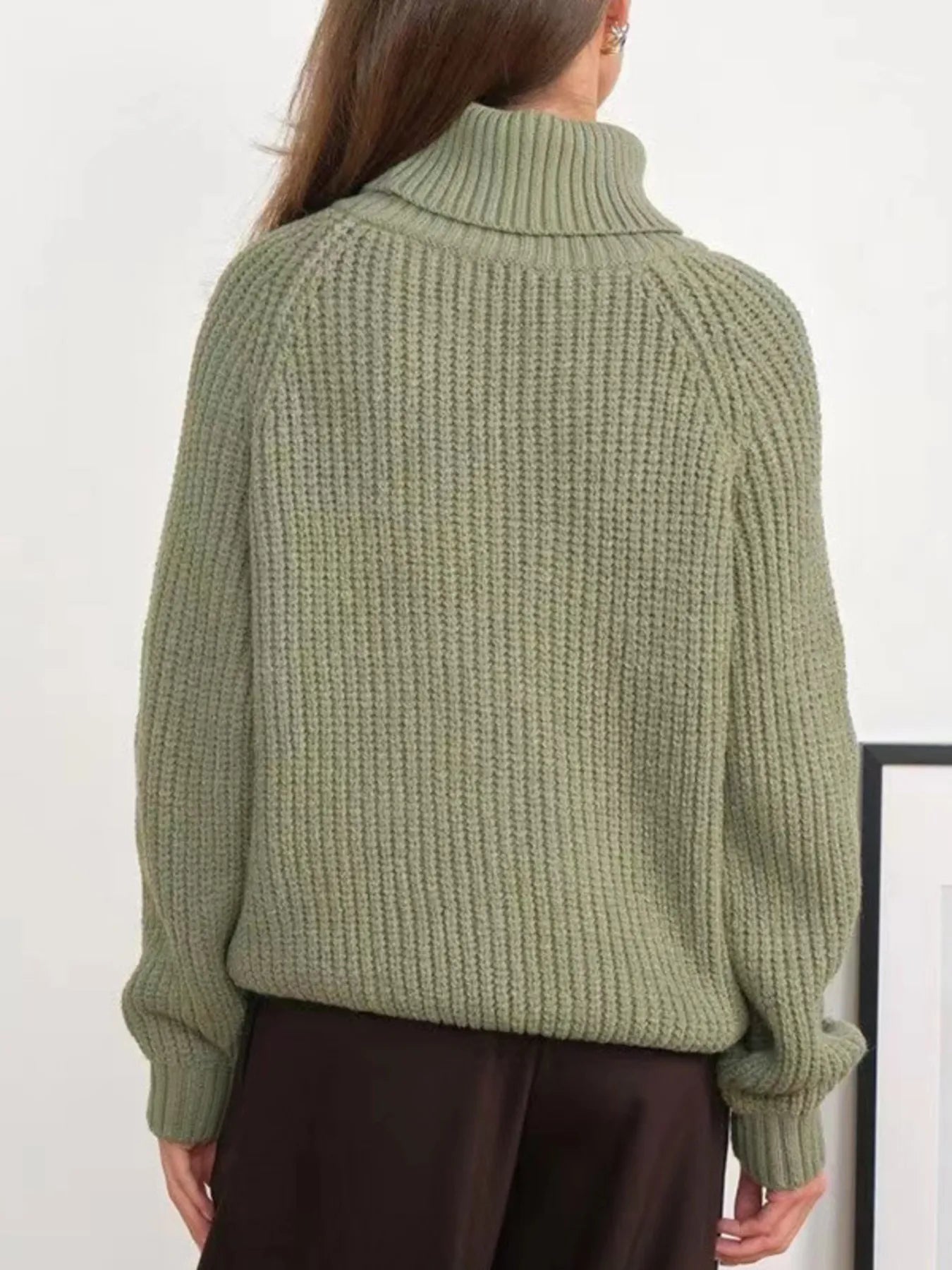 Green oversized turtleneck long sleeve sweater back view on model